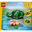 LEGO Creator 3-in-1 set 31377 featuring a green brick turtle with large eye and tan shell details, accompanied by a pink and yellow water lily flower on green lily pad leaves, displayed with two alternative animal build options shown on yellow banners, set against a natural landscape background with blue water, 124 pieces, age 7+