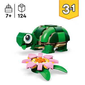 LEGO Creator 3-in-1 green turtle with tan shell straps and large eye piece shown with pink and yellow water lily flower build set containing 124 pieces for ages 7 and up