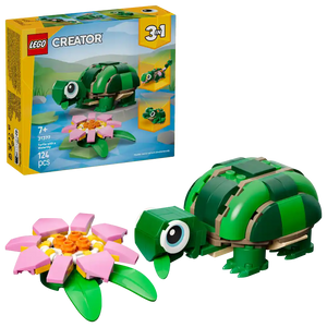 LEGO Creator 3-in-1 set 31377 showing green turtle with tan shell straps and pink water lily flower with yellow center, displayed with original yellow and blue box packaging