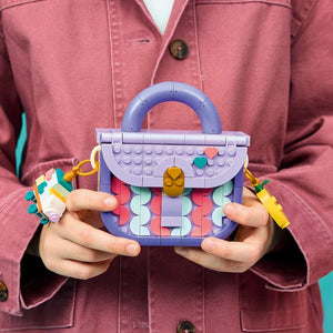 LEGO Creator Art Fashion Bag with Storage 31391 - a child playing with the finished build. 272 pieces. Ages 8+.