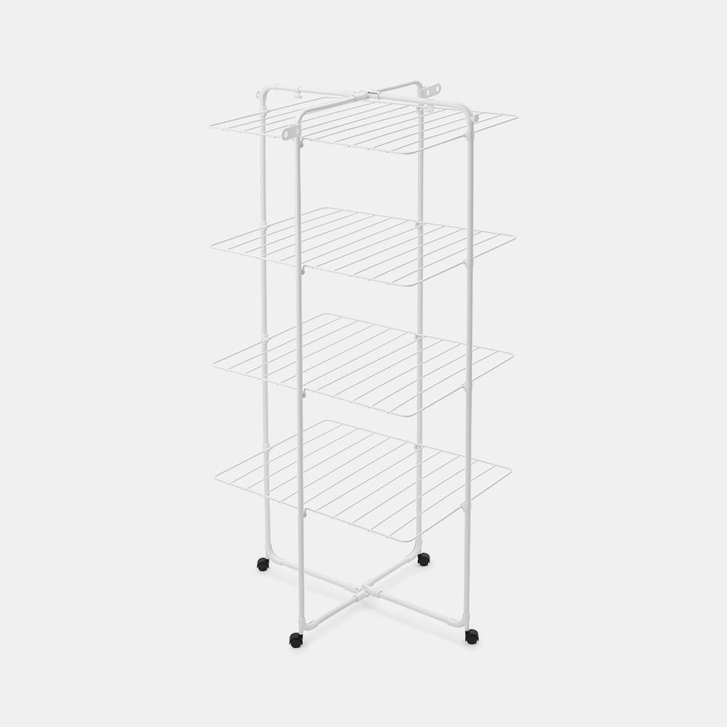 White metal tower clothes airer with four horizontal drying shelves, cross-base frame design, and black wheels for mobility