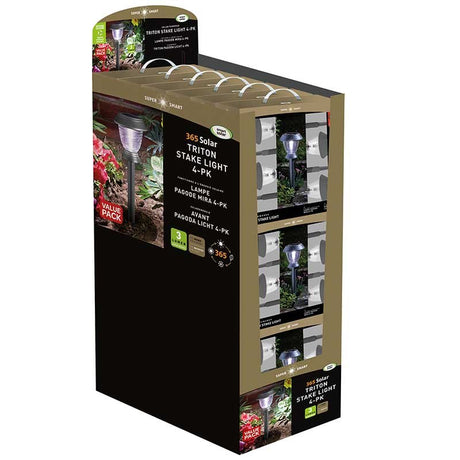 Display stand for 365 Solar Triton Stake Light 4-pack garden lights showing product packaging with multiple boxed units, featuring purple LED solar lights with black and tan colored retail display box
