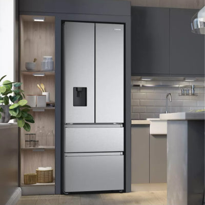 Modern kitchen with a stainless steel refrigerator.