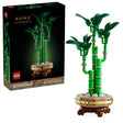 LEGO Lucky Bamboo 10344 set showing green bamboo stalks with leaves on decorative pot with gold and tan bands, displayed next to original packaging box labeled Botanicals with 325 pieces for ages 18+