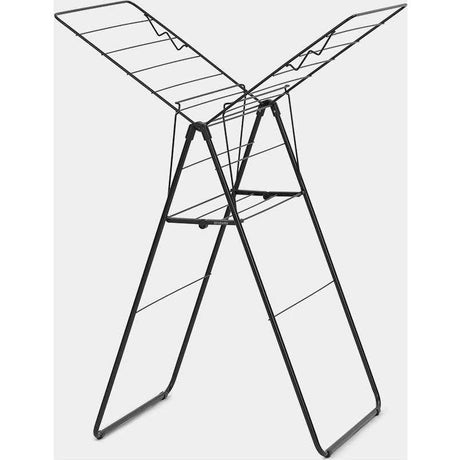 Black metal freestanding clothes airer with two hinged wings and horizontal drying rails, showing front three-quarter view of the Brabantia HangOn model