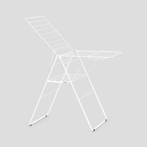 White Brabantia HangOn Winged Clothes Airer with extended drying rails shown from an angled view against a grey background