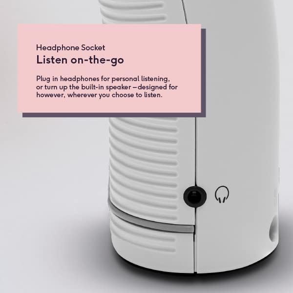 White cylindrical portable DAB FM digital radio with headphone socket, featuring built-in speaker and headphone jack icon, displayed with product information label on pink background