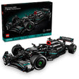 LEGO Technic Mercedes-AMG F1 W14 E Performance set 42171 showing black and teal Formula 1 racing car model with detailed engine components, large black tires with green rims, red accents, and PETRONAS branding displayed both assembled and in original box packaging containing 1042 pieces