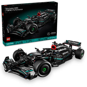 LEGO Technic Mercedes-AMG F1 W14 E Performance set 42171 showing black and teal Formula 1 racing car model with detailed engine components, large black tires with green rims, red accents, and PETRONAS branding displayed both assembled and in original box packaging containing 1042 pieces