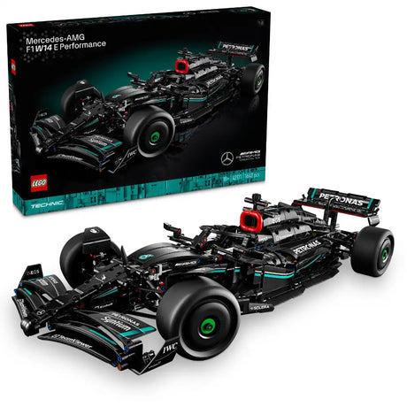LEGO Technic Mercedes-AMG F1 W14 E Performance set 42171 showing black and teal Formula 1 racing car model with detailed engine components, large black tires with green rims, red accents, and PETRONAS branding displayed both assembled and in original box packaging containing 1042 pieces
