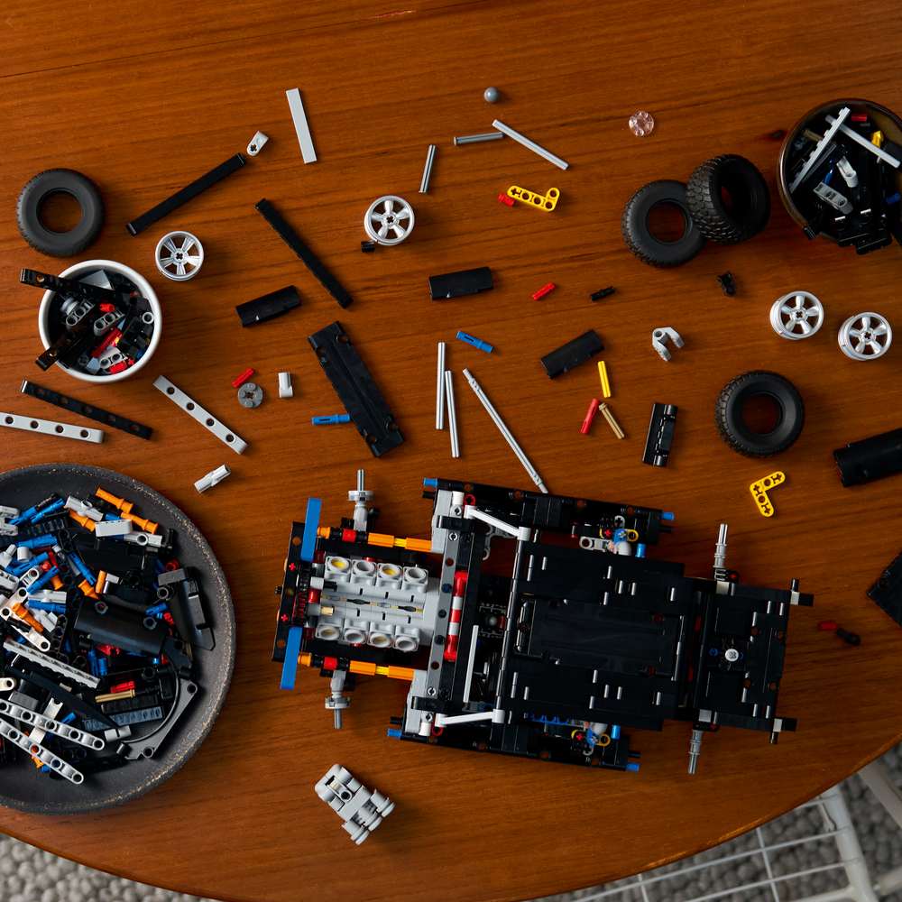 LEGO Technic Fast and Furious Dodge Charger R/T Car 42231 - a child building the set. 1516 pieces. Ages 18+.