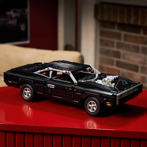 LEGO Technic Fast and Furious Dodge Charger R/T Car 42231 - the finished build shown in a home setting. 1516 pieces. Ages 18+.