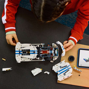 LEGO Technic Dodge Viper GTS-R Sports Car 42234 - a child building the set. 805 pieces. Ages 10+.