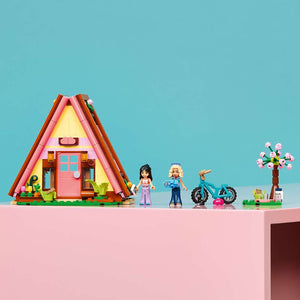 LEGO Friends Nature Glamping Cabin 42682 - the finished build shown in a home setting. 295 pieces. Ages 6+.