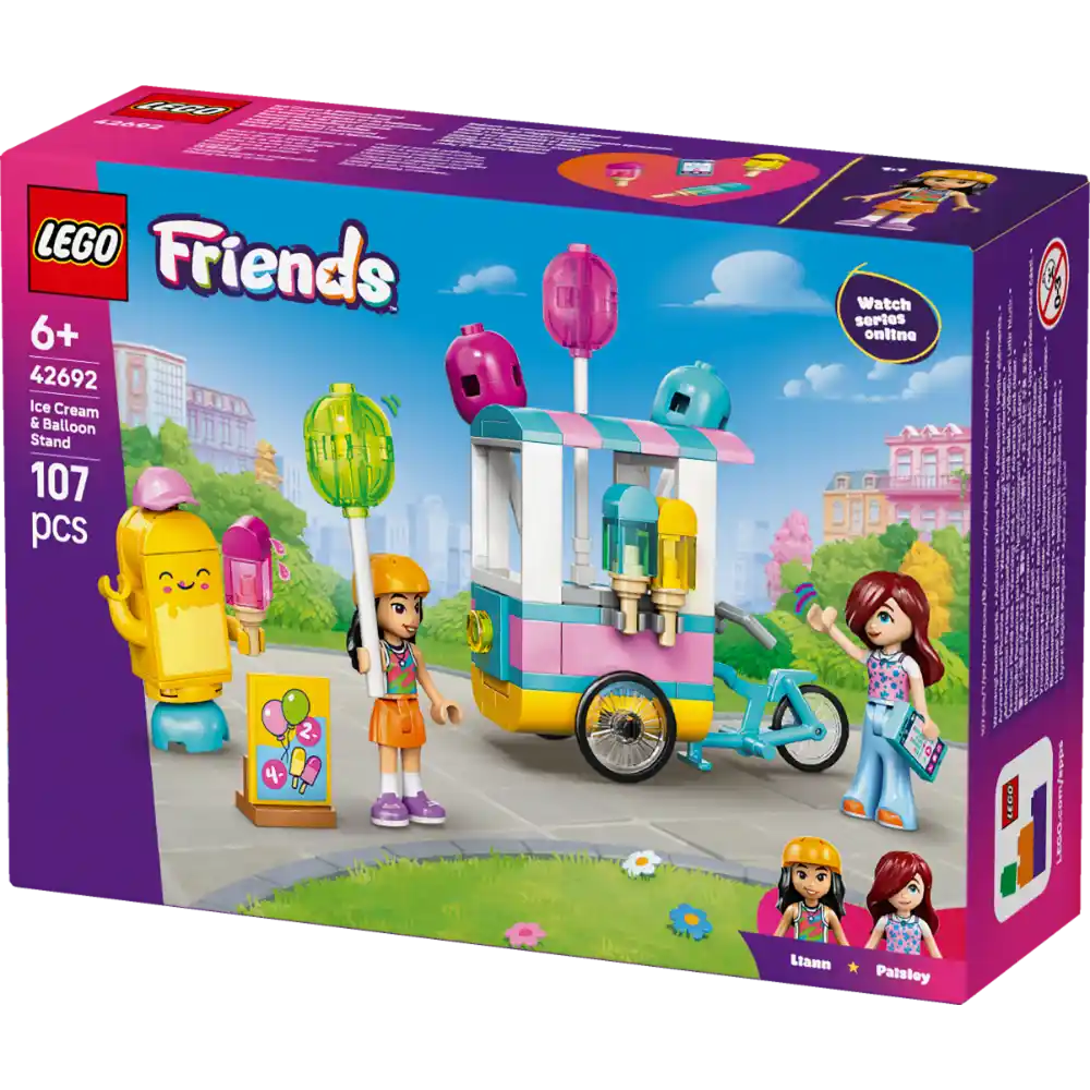 LEGO Friends Ice Cream and Balloon Stand set 42692 box showing colorful ice cream cart with pink and turquoise awning, yellow banana character, two minifigure girls, blue bicycle, and balloon stand pieces against vibrant playground background, 107 pieces for ages 6+