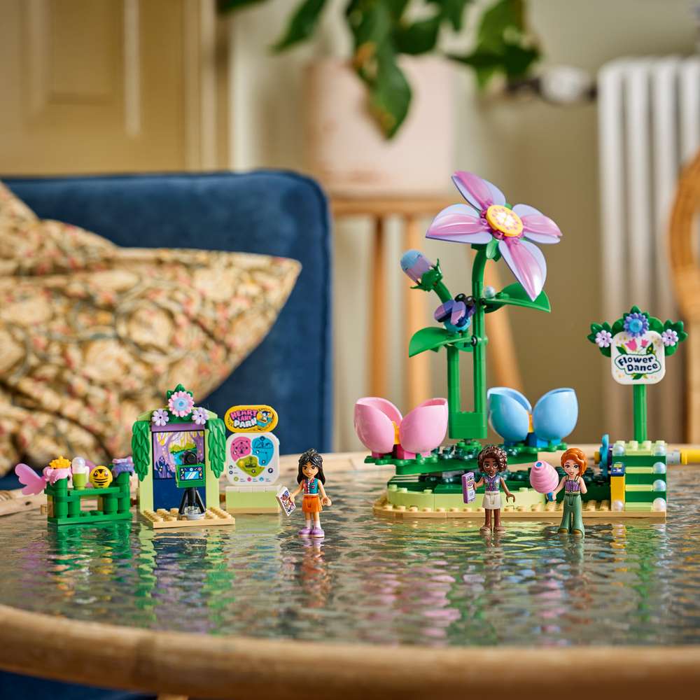 LEGO Friends Spinning Flower & Fairy Teacup Ride 42702 - the finished build shown in a home setting. 321 pieces. Ages 7+.