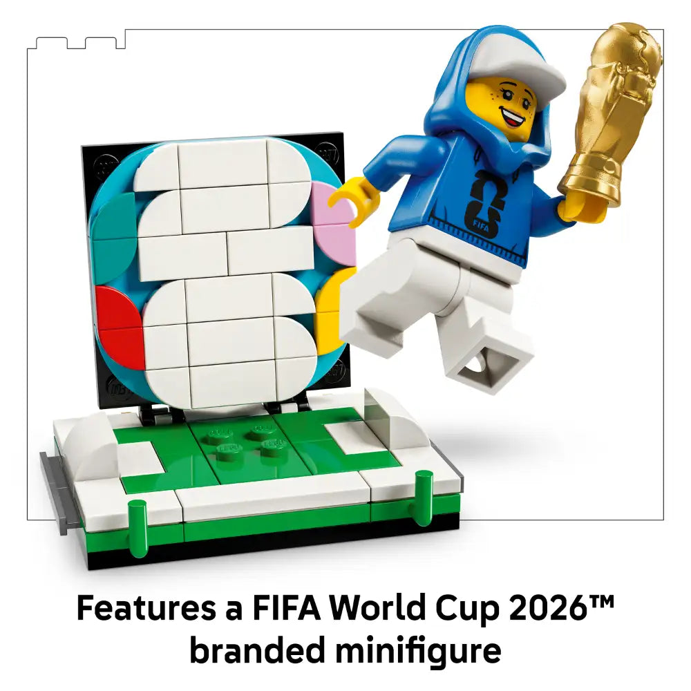 LEGO FIFA World Cup 2026 Official Trophy set 43020 featuring a blue and yellow minifigure holding a golden trophy, colorful rotating display mechanism with white tiles, and green and white football pitch base