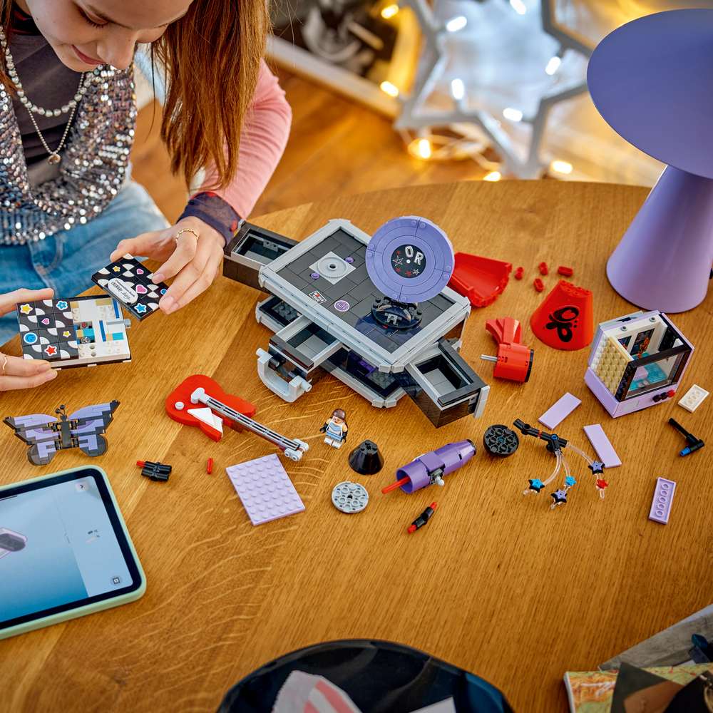 LEGO Editions Music Olivia Rodrigo's Secret Storage 43030 - a child building the set. 1085 pieces. Ages 10+.
