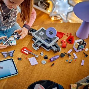 LEGO Editions Music Olivia Rodrigo's Secret Storage 43030 - a child building the set. 1085 pieces. Ages 10+.