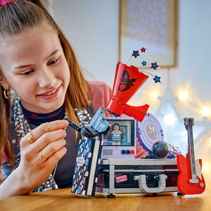 LEGO Editions Music Olivia Rodrigo's Secret Storage 43030 - a child playing with the finished build. 1085 pieces. Ages 10+.