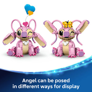 Two LEGO buildable Angel figures with pink and tan construction brick bodies, purple limbs, large pink ears with antenna, closed happy eyes, and poseable wings in different display positions, featuring blue and yellow heart decorations above, shown against a white and blue gradient background with text indicating multiple pose options