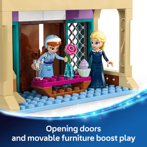 LEGO Arendelle Castle Frozen set 43265 featuring two blonde and brown-haired minifigures in blue and dark blue outfits standing in a cream and teal colored castle entrance with opening doors, pink flower vase, ice-blue baseplate and movable furniture pieces