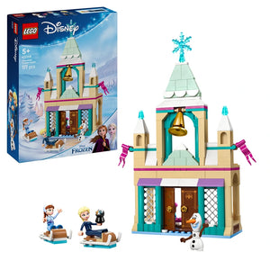 LEGO Disney Frozen Arendelle Castle set 43265 featuring a turquoise and cream colored castle tower with snowflake topper, gold bell, purple accents, minifigures of Elsa and Anna, Olaf snowman character, and winter-themed accessories on display with original packaging box