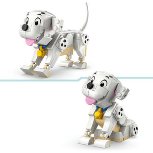 LEGO construction of a white and tan puppy character with pink tongue and blue collar, shown in standing and sitting poses with articulated limbs and tail, inspired by 101 Dalmatians