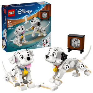 LEGO Disney 101 Dalmatians Lucky and Penny Puppies set 43271 featuring two white and black spotted dalmatian puppy minifigures with yellow collars, vintage television set, and building instructions shown on blue retail box packaging with 268 pieces for ages 6 and up