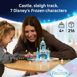 Adult and child playing with LEGO Disney Frozen Elsa's Ice Castle set featuring blue ice palace structure with snowflake topper, minifigures and accessories on wooden table, 216 pieces, age 4+