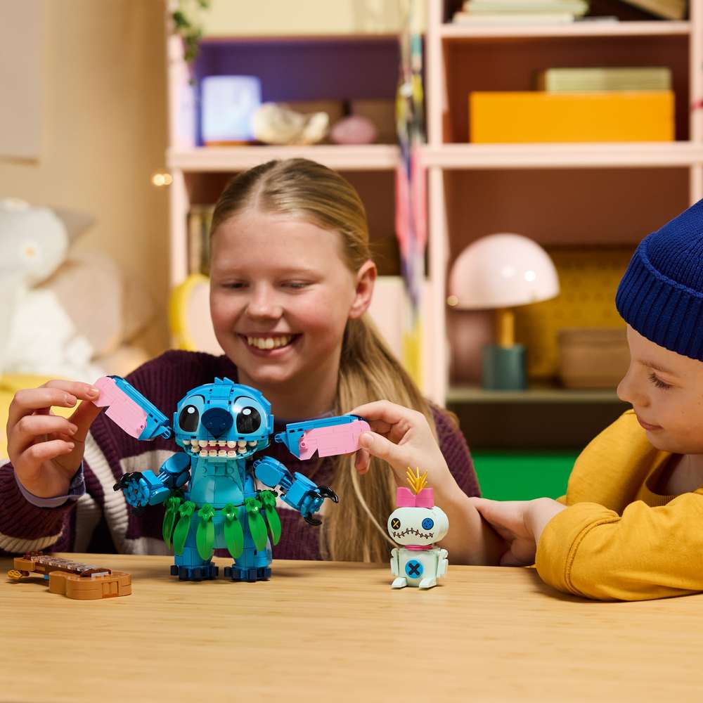 LEGO Disney Classic Stitch & Scrump 43296 - a child playing with the finished build. 713 pieces. Ages 9+.