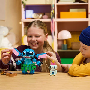 LEGO Disney Classic Stitch & Scrump 43296 - a child playing with the finished build. 713 pieces. Ages 9+.