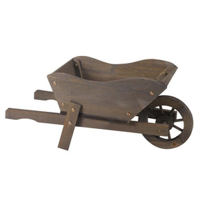 Wooden wheelbarrow planter with dark brown finish, featuring a curved cargo bed, two wooden handles, brass fasteners, and a decorative wooden wheel, ideal for garden displays