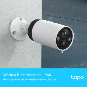 TP-Link Tapo white weatherproof outdoor security camera mounted on wall showing IP65 water and dust resistant design with night vision LEDs and blue lens