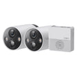 TP-Link Tapo C420S2 wireless security camera system with two white and black outdoor cameras with LED lights and hub unit on white background