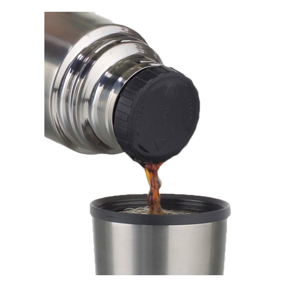 Thermos stainless steel flask 1 litre pouring hot brown liquid into matching metal cup with black lid and cap
