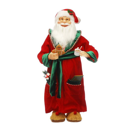 Decorative Santa Claus figure holding a cup and cookies on a white background