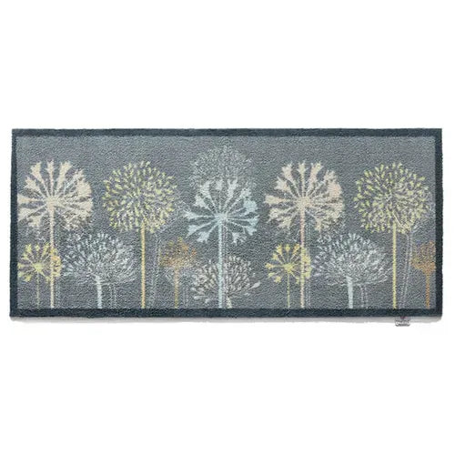 Hug Rug runner mat 65cm x 150cm with nature-inspired tree design featuring cream, white and sage green dandelion trees on charcoal grey background, durable indoor outdoor rug