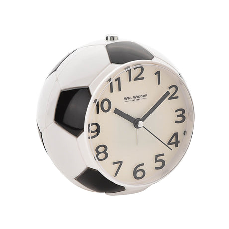 White football soccer ball shaped alarm clock with black pentagon panels, cream dial face, black numerals and hands, WM. Widdop branding, silver top winder and chrome accents on white background