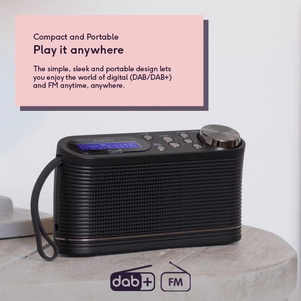 Roberts PLAY10BK black portable DAB FM digital radio with textured finish, tuning dial and control buttons, displayed on stone surface with carrying strap and product information panel above highlighting compact portable design