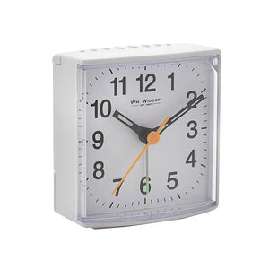 White square alarm clock by Widdop with rounded corners, white face, black numerals, black hour and minute hands, orange second hand, and green 6 marker, featuring sweep movement mechanism