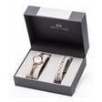 Newgrange Living rose gold watch and bracelet set in black presentation box with white interior, featuring a round face watch with matching rose gold chain bracelet and decorative crystal-embellished bracelet