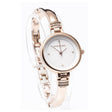 Rose gold bangle watch with white dial, diamond indices, and decorative crystal-embellished lugs by Newgrange Living