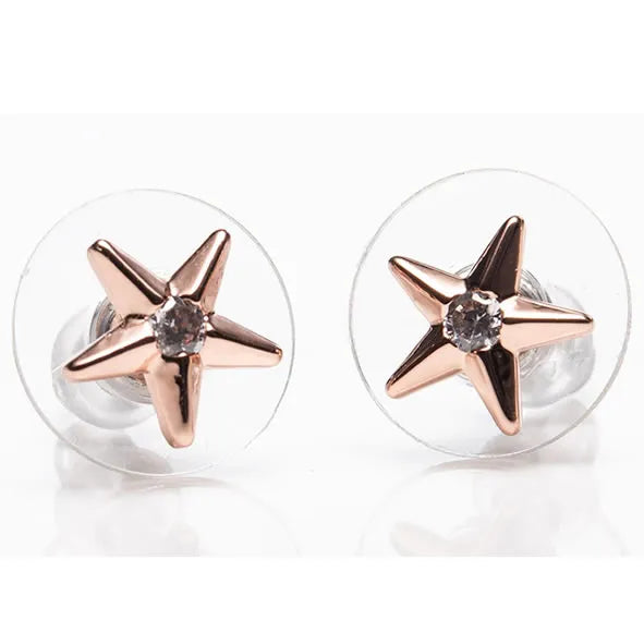 Pair of rose gold star stud earrings with clear acrylic backs featuring diamond centers, displayed on white background