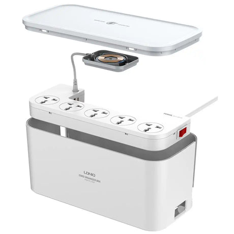 White power strip with multiple sockets and a small lamp on a white background