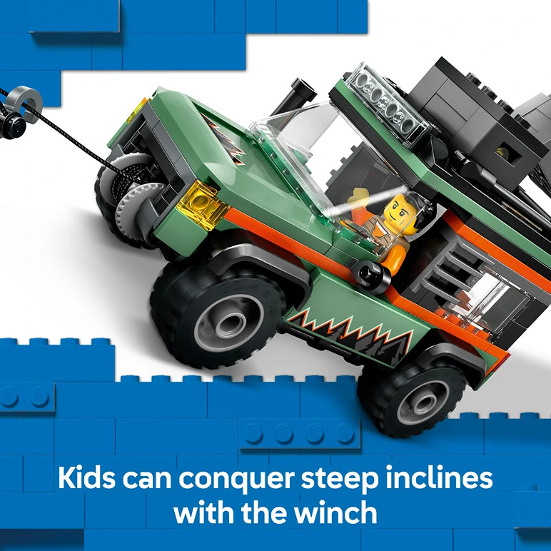 LEGO Off-Road 4x4 Mountain Truck set 60447 featuring a green and orange buildable truck with working winch mechanism, minifigure driver, and large black tires against blue LEGO brick background