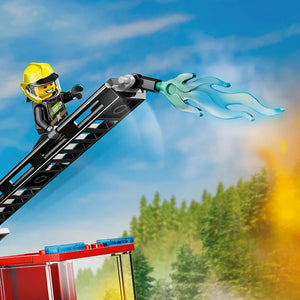 LEGO fire ladder truck 60463 set featuring yellow-helmeted firefighter minifigure on extended black ladder spraying water stream against blue sky and green forest background with red fire truck base