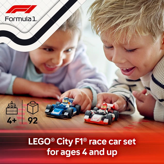 Two young children playing with LEGO Formula 1 race cars on a wooden table, featuring a blue Williams F1 car and a red and white Haas F1 car, with Formula 1 branding and product details showing ages 4 and up and 92 pieces