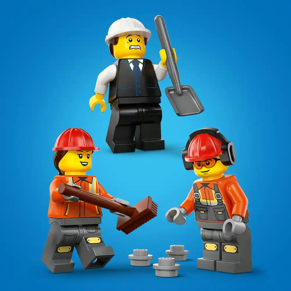 LEGO construction worker minifigures set featuring three yellow-faced characters in safety gear including hard hats and orange vests, with a supervisor in white helmet and business attire holding a shovel, accompanied by gray LEGO bricks and construction accessories against blue background