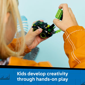 Child in orange jacket holding black and neon green LEGO race car toy with yellow wheels against blue sky background, demonstrating hands-on creative play with building blocks